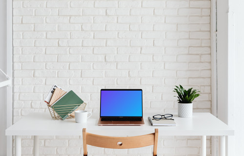 MacBook Air mockup beside a basket of books