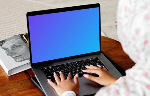 MacBook Air mockup in use by a lady with a head covering