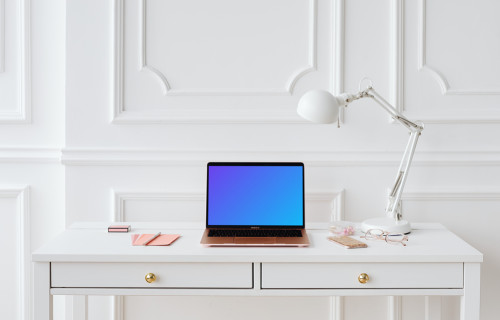 MacBook Air mockup on a table beside an iPhone