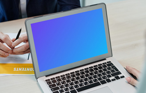 MacBook Air mockup on a wooden table