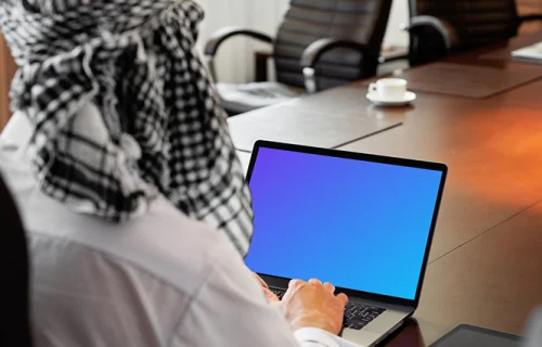 MacBook Air mockup used by a lady with a head covering