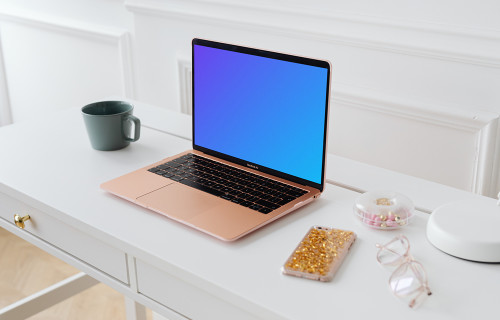 MacBook Air mockup with an iPhone at the side