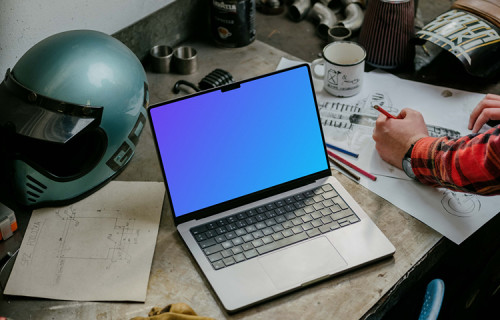 MacBook Pro mockup beside machine drawing