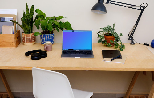  MacBook Pro mockup on a light brown table.