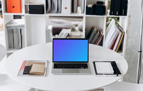 MacBook Pro mockup on a white round table