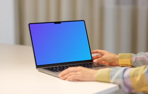 MacBook Pro Mockup with Female Hand on a Modern Desk