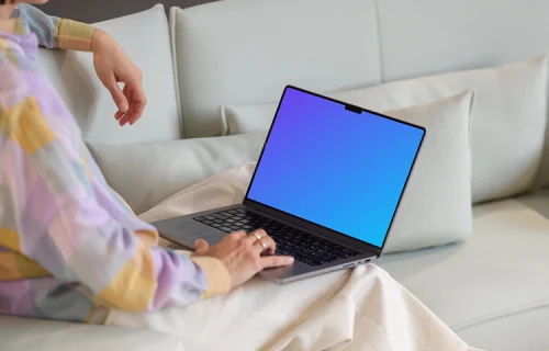 MacBook Pro mockup with woman on a modern sofa