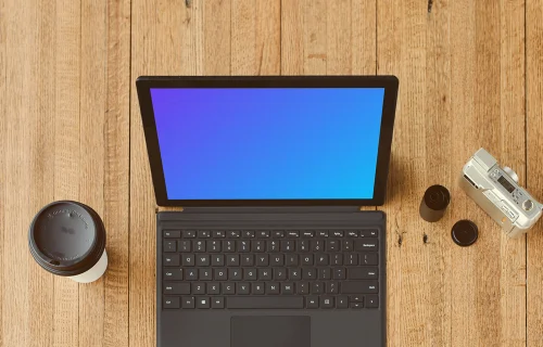 Microsoft Surface Laptop mockup beside a cup of coffee