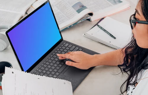 Microsoft Surface laptop mockup used by a lady in glasses