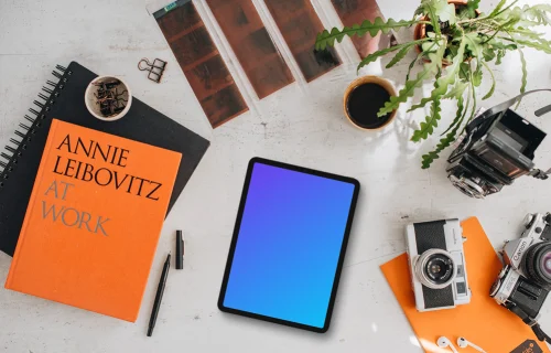 Mockup of tablet device next to the colorful books