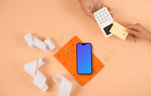 Peachy background, payment terminal and an iPhone mockup