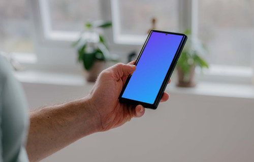 Person holding a Pixel 6 mockup