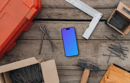 Phone mockup between workshop essentials