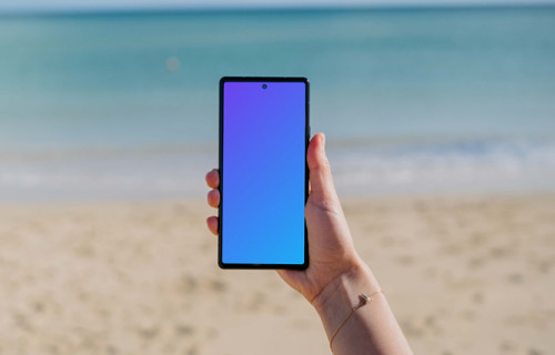 Pixel 6 mockup held by a user at the beach