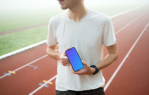 Runner holding iPhone 14 Pro