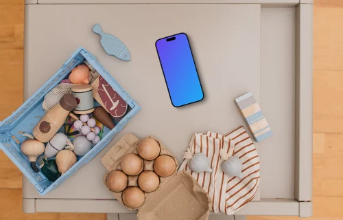 Smartphone mockup among children's toys