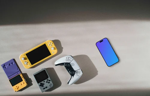 Smartphone mockup among gaming devices on neutral background