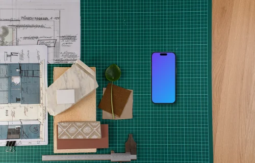 Smartphone mockup on architect's table