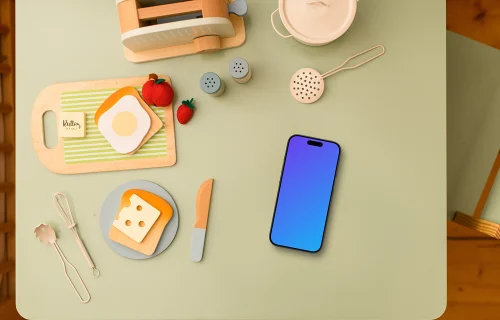 Smartphone mockup with children's play kitchen accessories