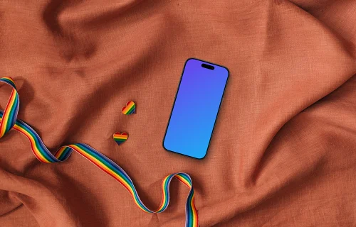 Smartphone mockups with LGBT themed ribbon and pins