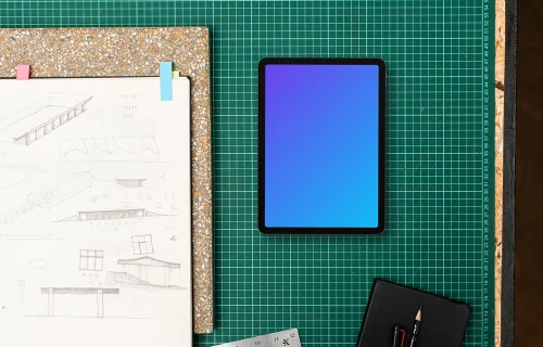 Tablet mockup alongside architect drawings