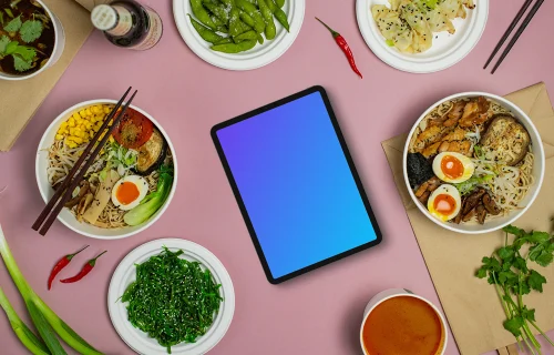 Tablet mockup between Japanese food