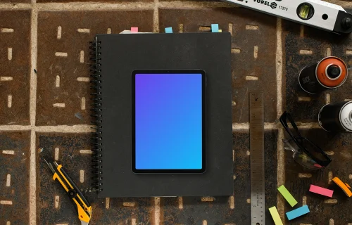 Tablet mockup on architect's desk with tools