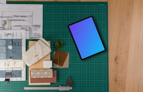 Tablet mockup on architect's planning table