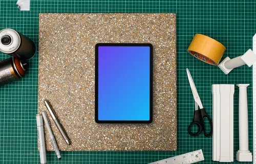 Tablet mockup on architects workspace with tools