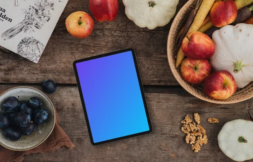 Tablet mockup surrounded by vegetables