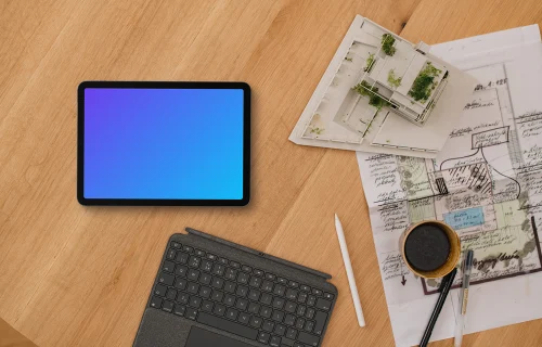 Tablet mockup with architect plans and coffee