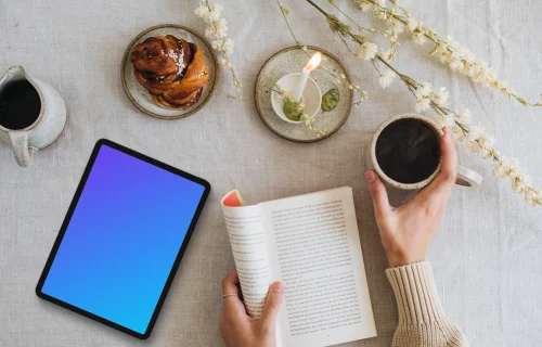 Tablet mockup with coffee and book on the table