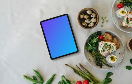 Tablet mockup with Easter snack and spring vegetables
