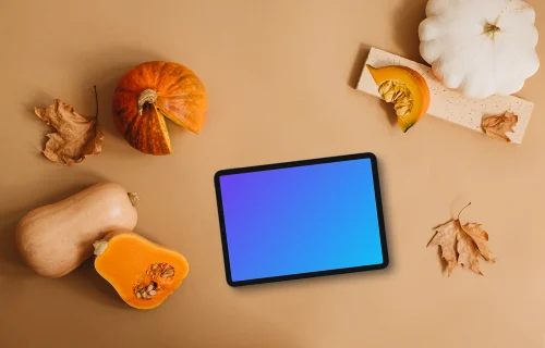 Top view of tablet mockup with pumpkins