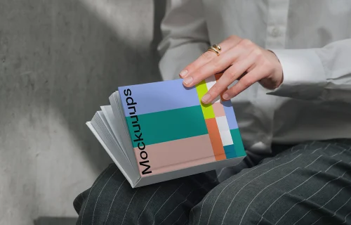 A-format book mockup held in hands