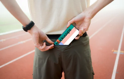 Athlete putting a phone in the pocket mockup