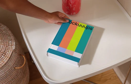 B-format book mockup on a modern white table