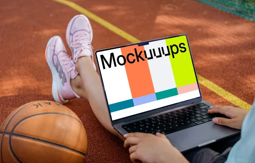 Basketball player checking on laptop mockup