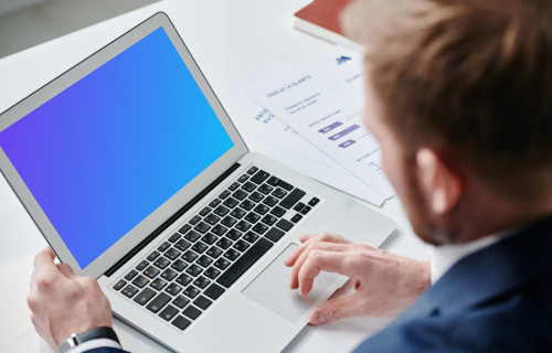 Businessman using an MacBook Air mockup