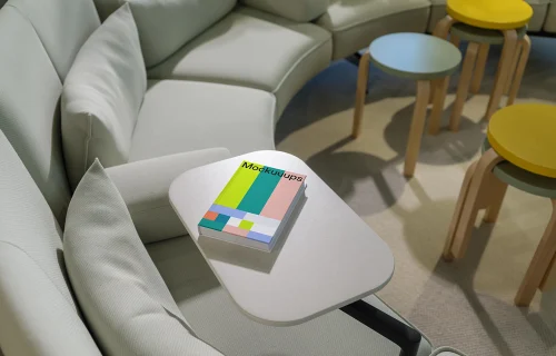 C-format book mockup on a modern lounge table