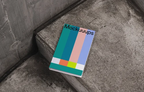 C-format book mockup on concrete stairs