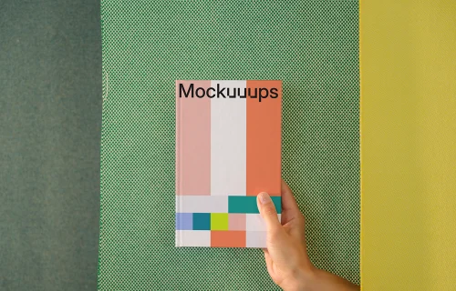 C-format book mockup with geometric background