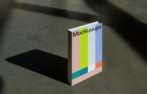 C-format book mockup with gradient cover on concrete surface