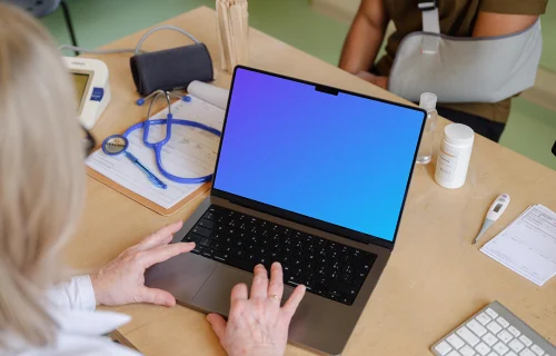 Doctor typing on a MacBook mockup