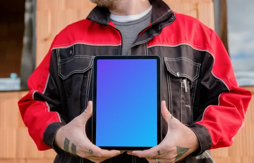 Engineer in construction presenting iPad mockup