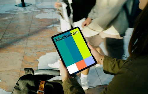 Female hands holding an iPad Air mockup