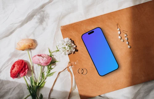 Flowers, wedding rings and iPhone mockup