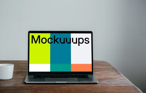 Front view of MacBook Pro mockup on a wooden table