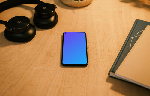 Google Pixel 5 mockup with a pair of headphones at the side