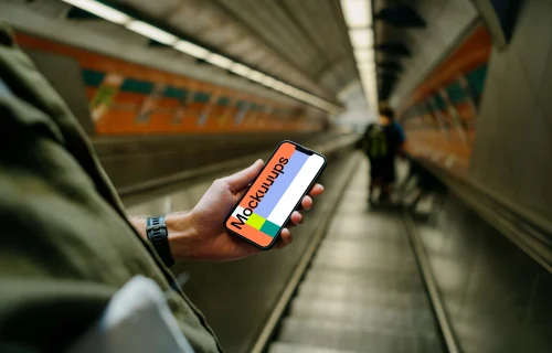 Hand holding a phone mockup